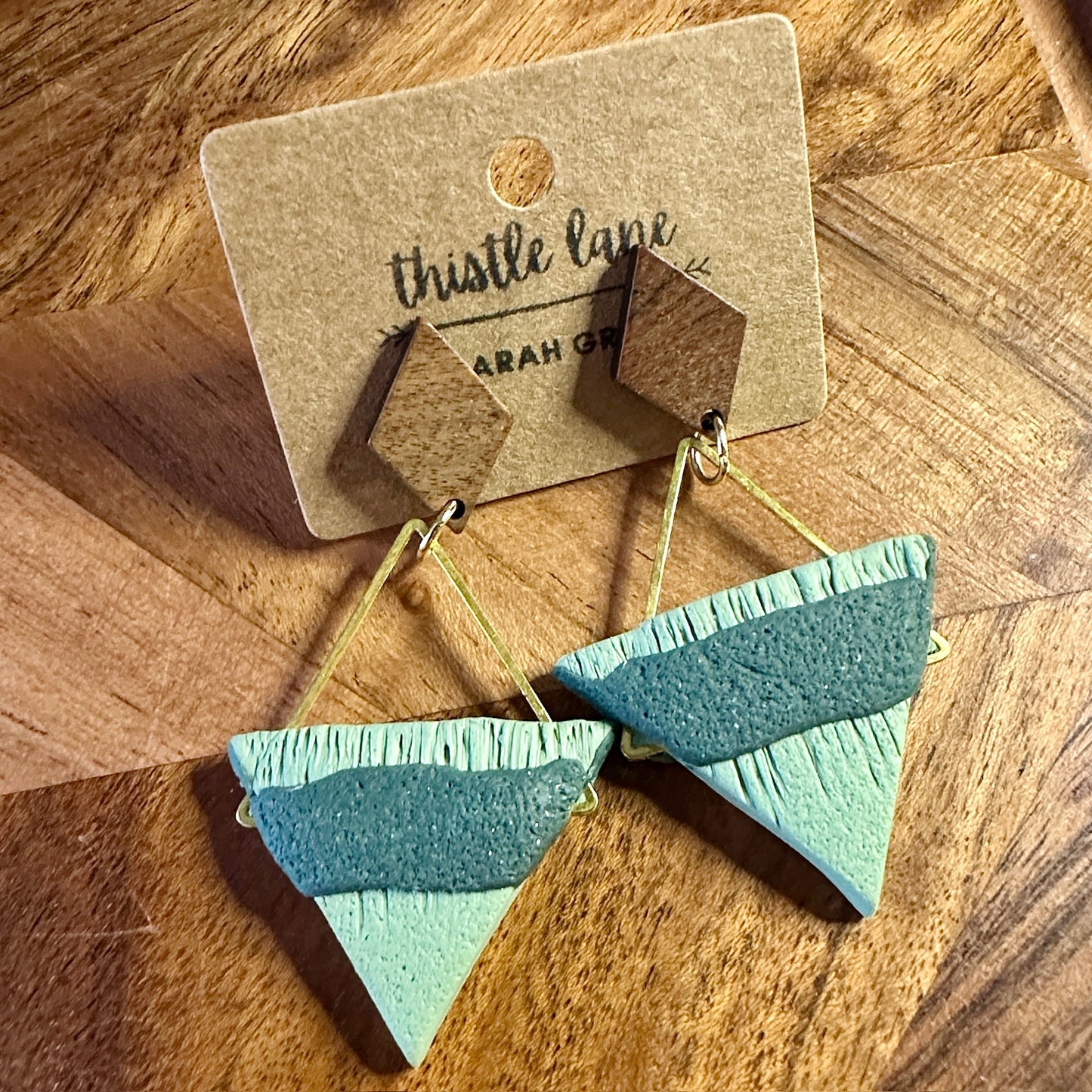 Green textured triangles on wood stud