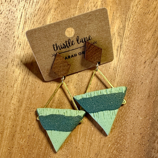 Green textured triangles on wood stud
